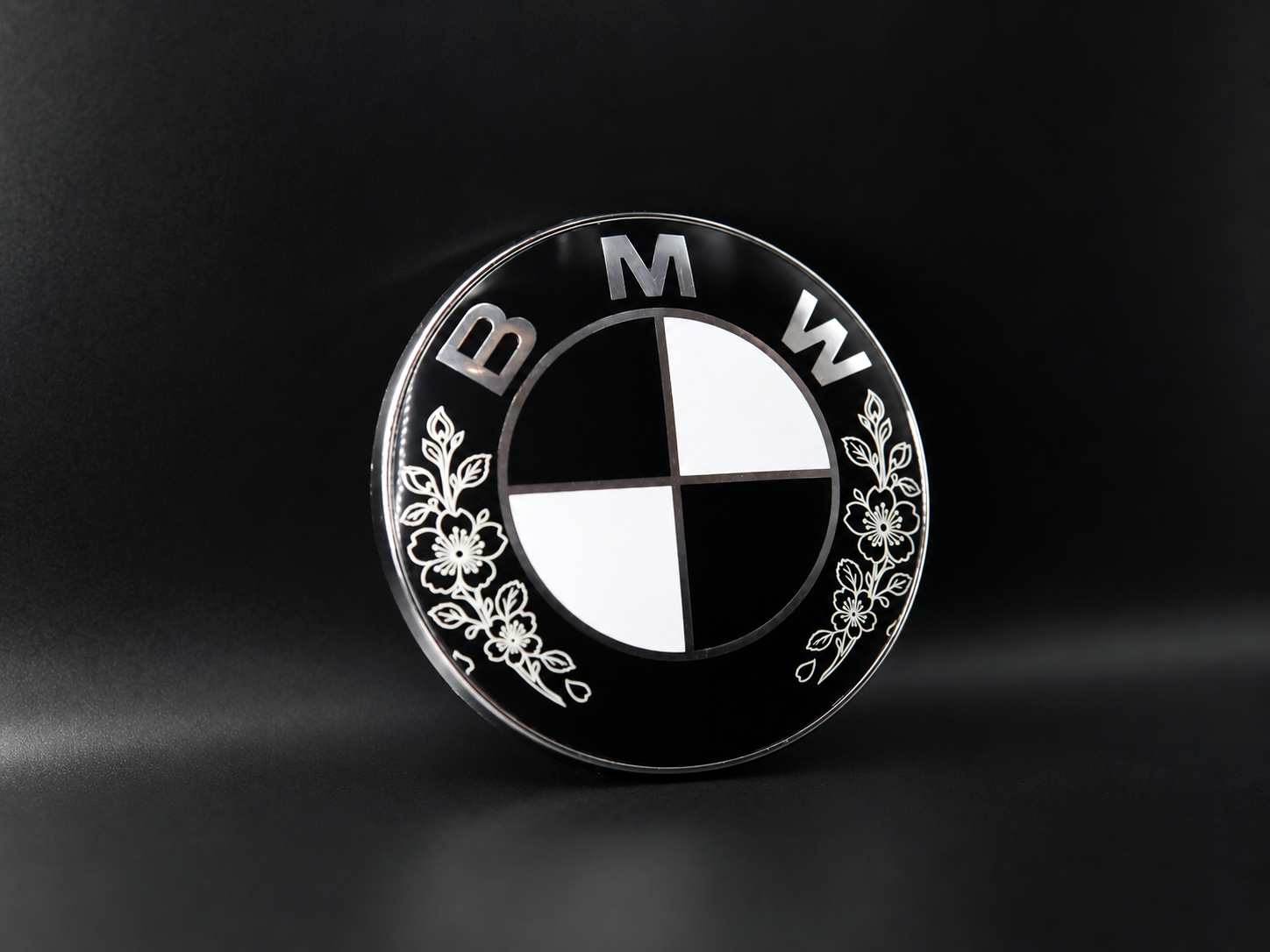 Engraved BMW badge, angled view